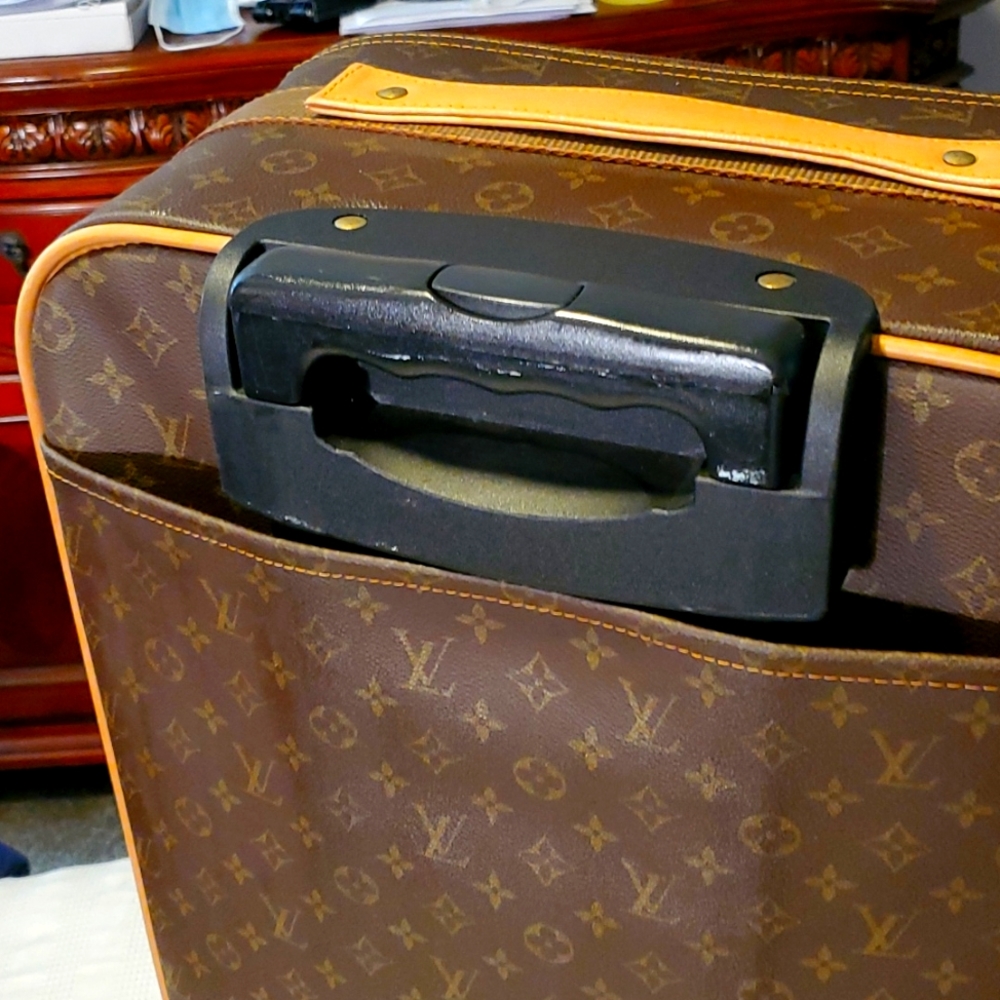 Lv luggage 14x24 selling cheap because I don't believe it authentic